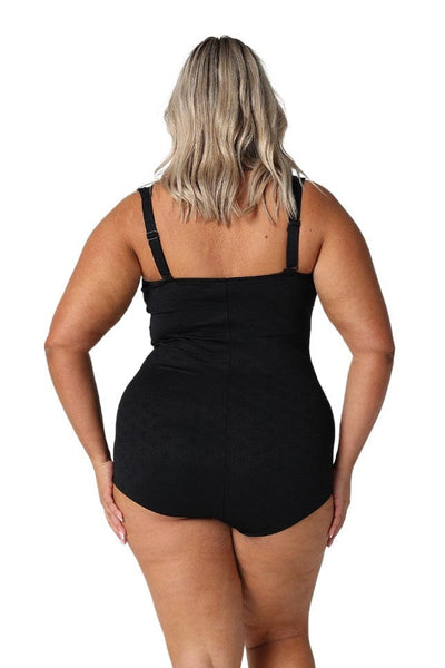 Model showing back of black retro skirted one piece