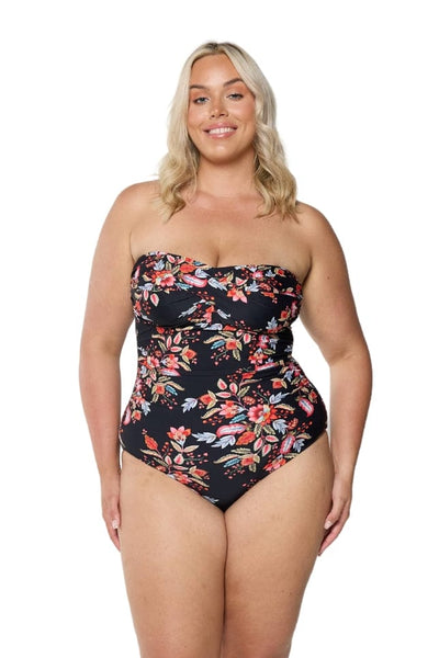 Blonde curve model showing off flattering bandeau swimsuit with grip tape