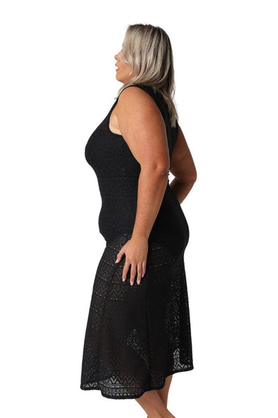 Model showing side of long black beach dress