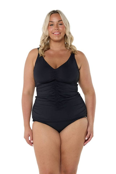 Blonde model wearing black ruched tankini top and matching bottom