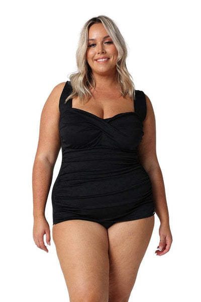 Model wearing black retro skirted one piece