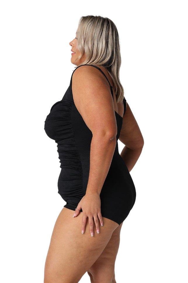 Model showing side of black retro skirted one piece