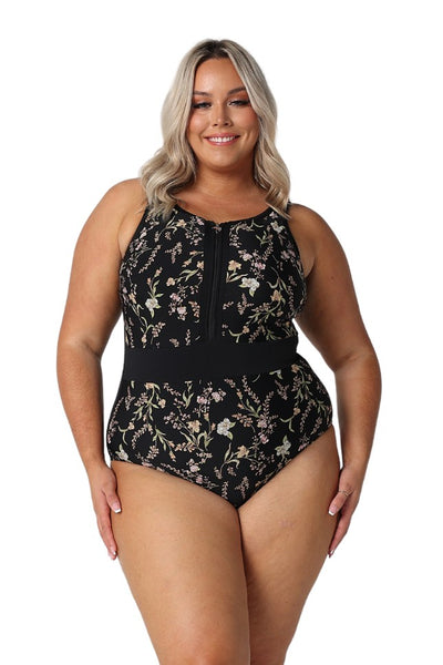 Model wearing black floral zip front one piece