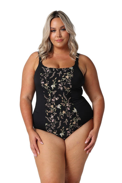 Model wearing black floral one piece swimsuit