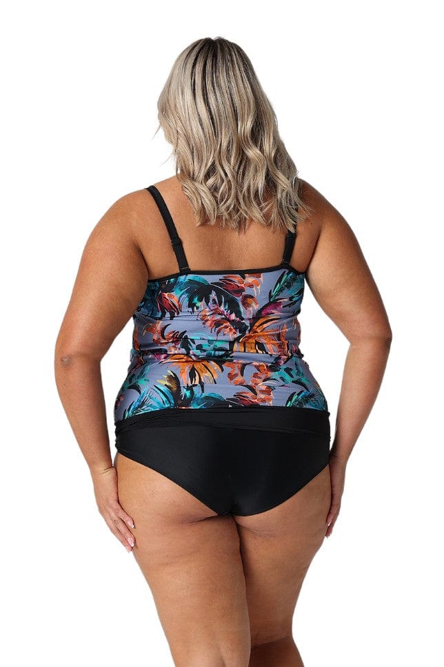 Back of plus size model in studio wearing flouncy bandeau in grey based floral print