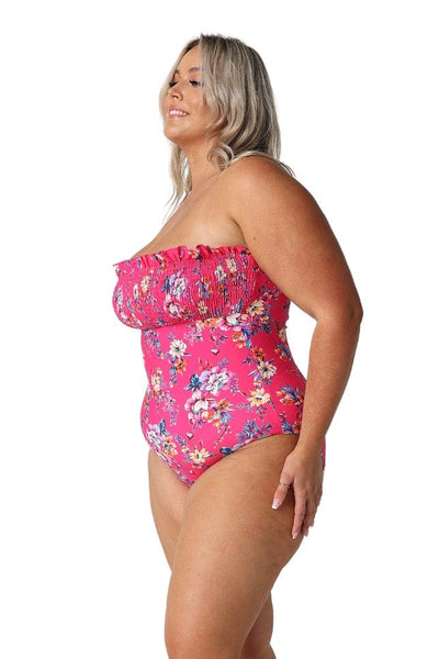 Model showing side of hot pink floral shirred one piece