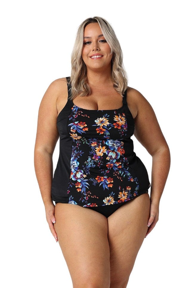 Blonde model in studio wearing curvy tankini top in blue and orange floral print with black base