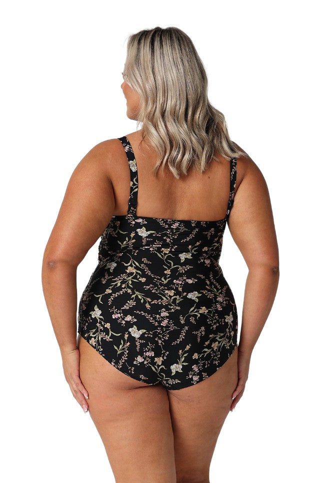 Model showing back of womens floral one piece