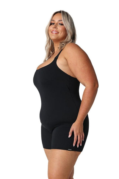 Side profile of blond plus size model wearing scoop neckline one piece with boyleg in chlorine resistant