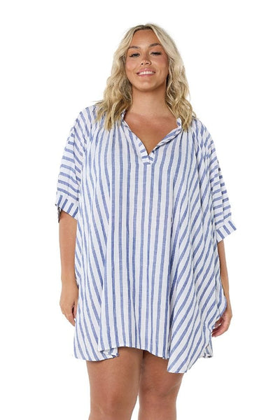 Front of model in studio wearing plus size navy white striped shirt with flattering neckline