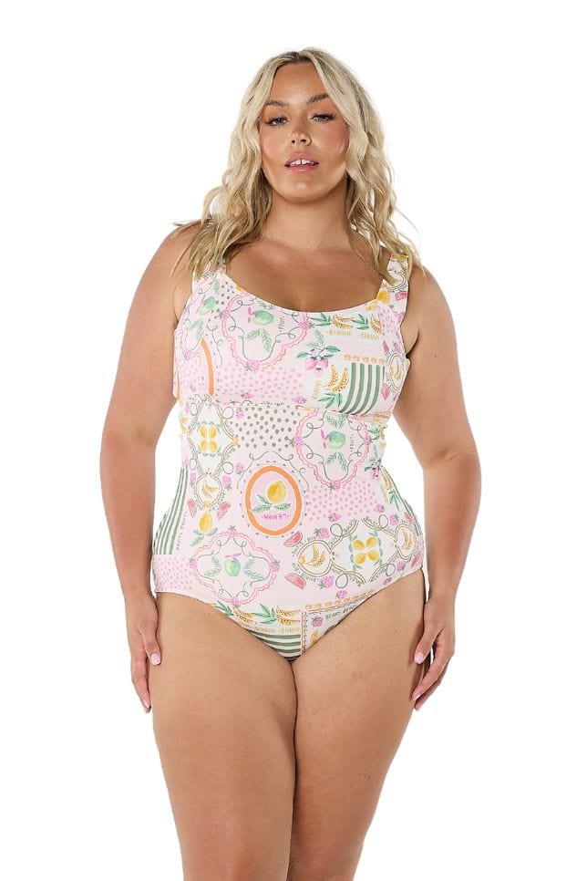 Model in studio showing front of square neckline swimsuit with colourful fruit print for curve women