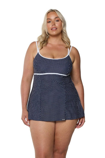 Model wearing navy and white dots underwire swim dress