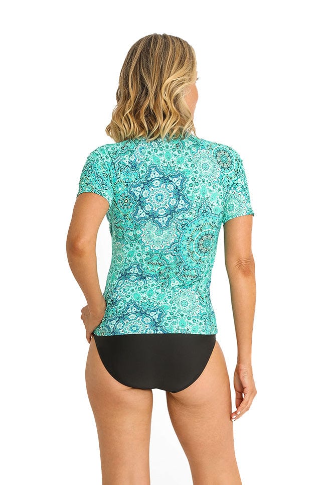 Model showing back of cyan patterned short sleeve rash vest