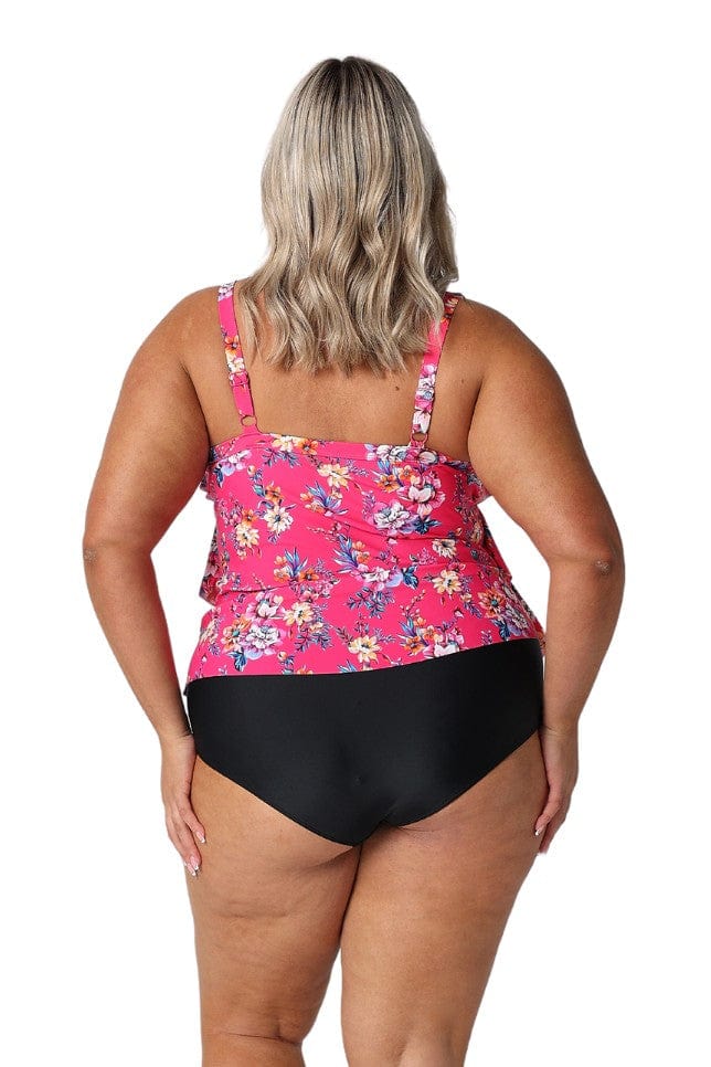 Model showing back of hot pink floral tankini top and black bottoms