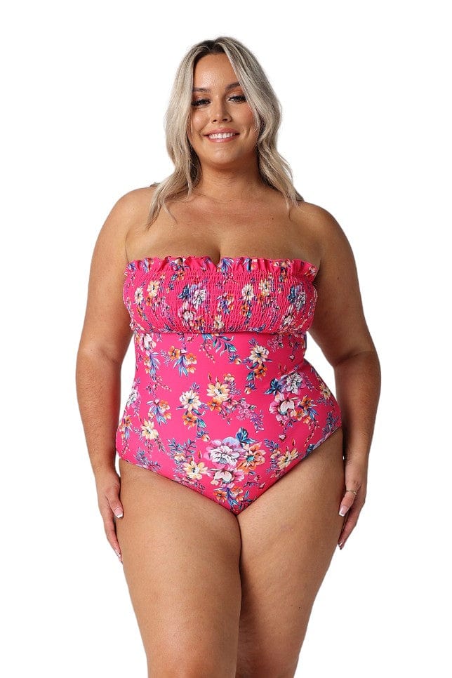 Model wearing hot pink floral shirred one piece