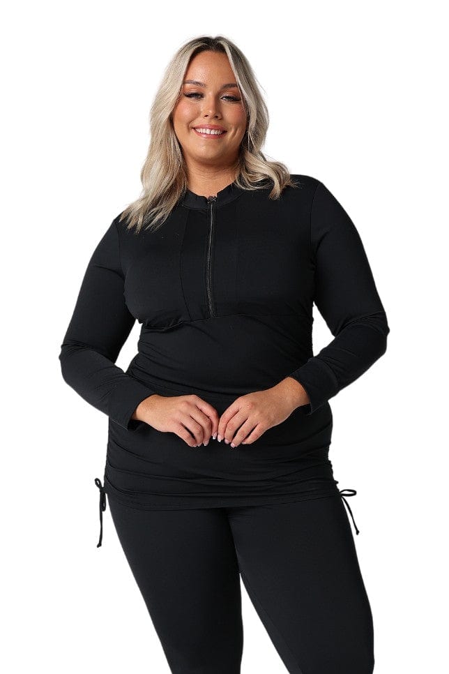 Blonde model in studio wearing plus size swim top with zip front detail and ruching in chlorine resistant