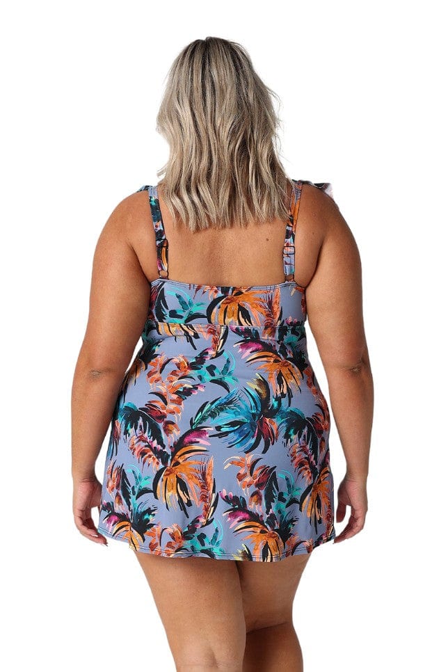 Back of model wearing floral swim dress with ruffle detail and adjustable straps