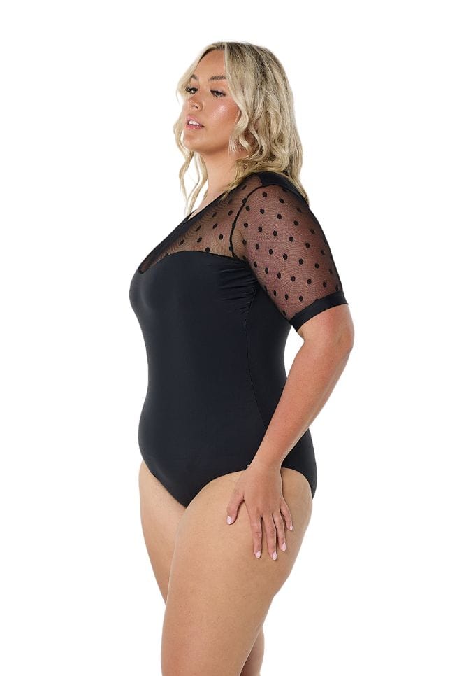 Blonde model wears heart shaped neckline with mesh polkadot