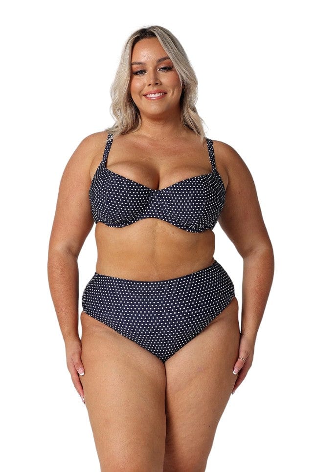 Front of model wearing high rise swim pants for curve women in navy and white