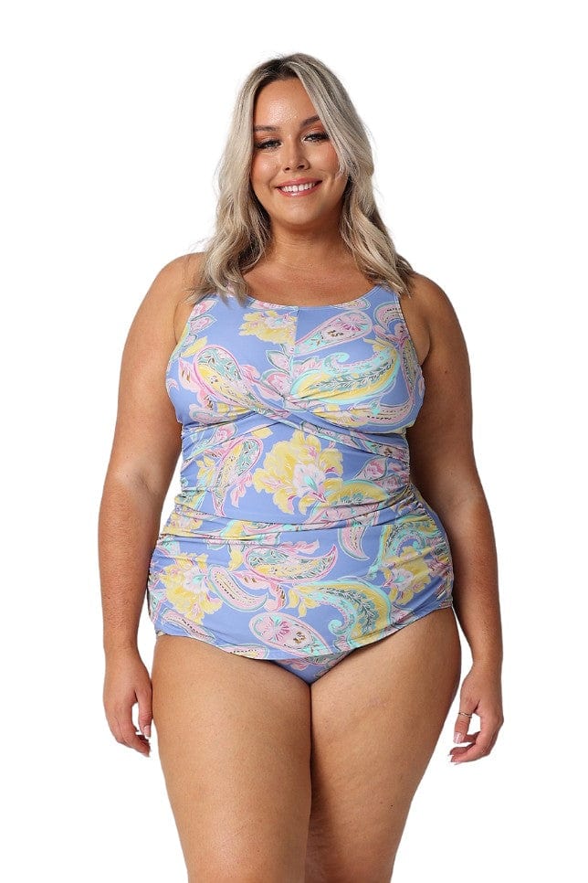 Blonde model in studio wearing flattering plus size tankini top with pastel colours and paisley print