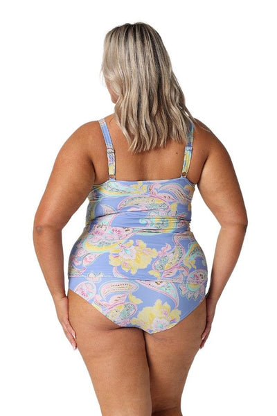 In studio model wearing paisley blue tankini top with high neckline and adjustable straps