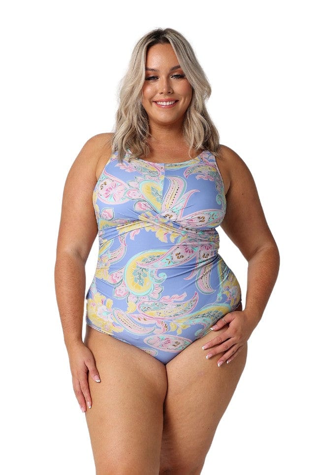 Blonde model wearing blue and yellow plus size one piece in paisley print