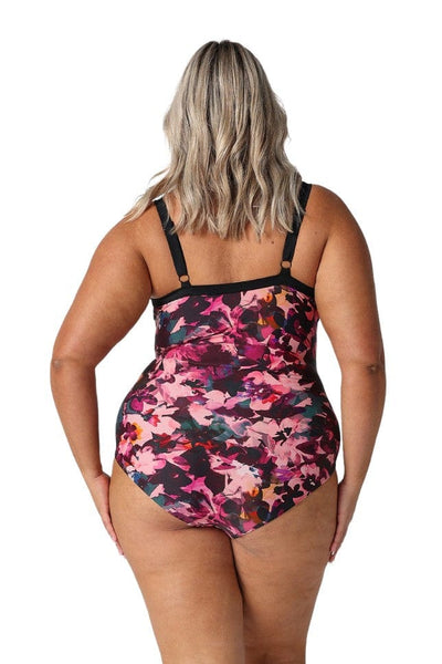 Back of model in studio showing back of womens plus size one piece