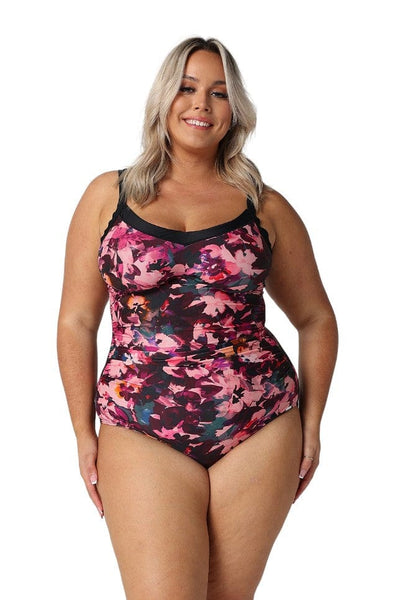 Blonde model in studio wearing floral one piece with underwire