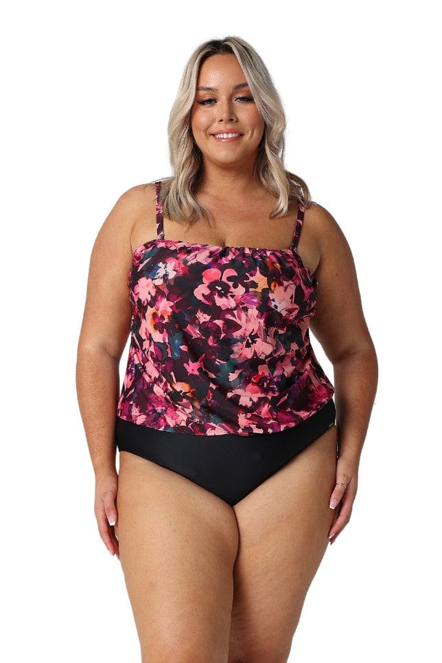 In studio model wearing pink floral and black bottom half with removable straps