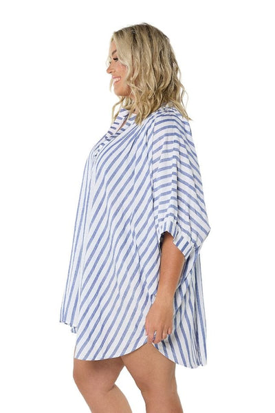 Side profile of plus size model in blue white striped beach shirt with v neckline