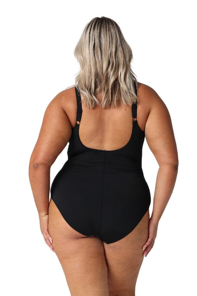 Back of model wearing plus size floral printed swimsuit with scoop back and adjustable straps 