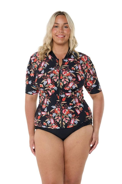 Model in studio wearing plus size rash vest in floral print for curve women