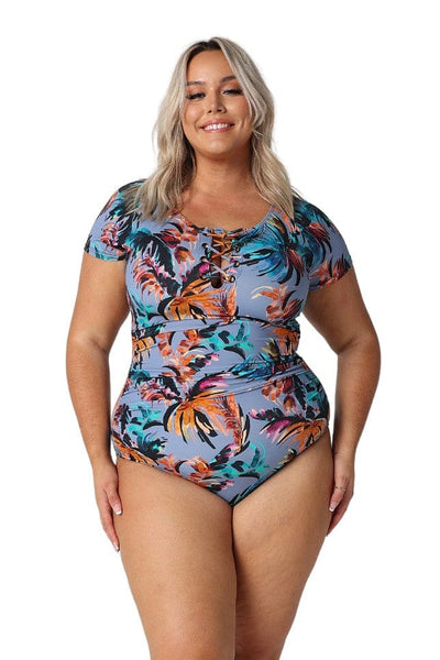 Blonde model in studio wearing cap sleeve one piece in floral print for curve women