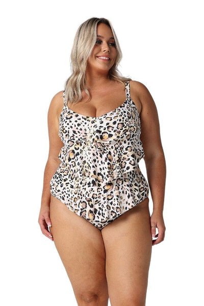 Blonde model in studio wearing tiered one-piece in black white and orange animal print swimsuit