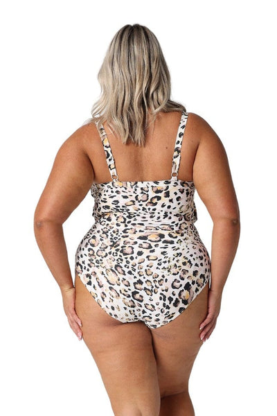 Back of model in studio wearing curvy animal print one piece with adjustable straps