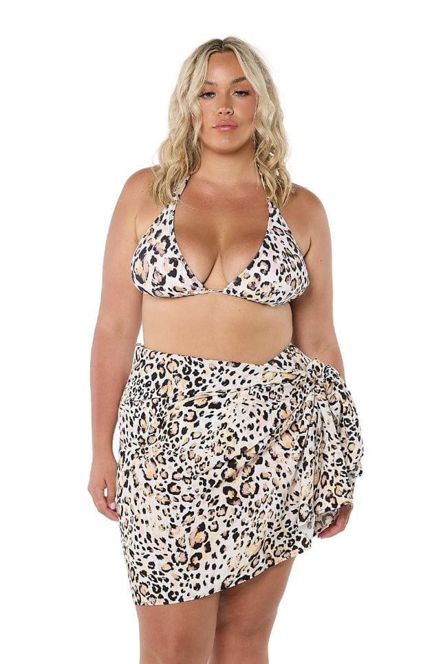 Blonde model in studio wearing animal print skirt for curve women with tie detail