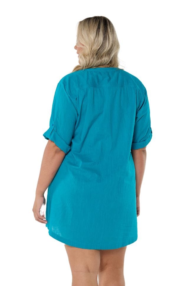 Model showing back of ocean blue swimwear over shirt