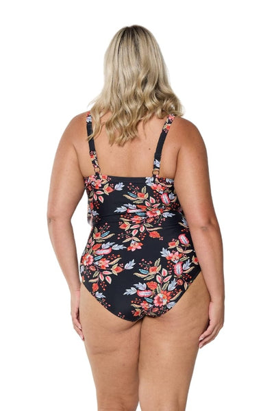 Back of model wearing tiered one piece in multi coloured floral print with adjustable straps