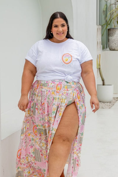 Brunette plus size model wearing white t shirt with colourful tutti frutti lemon Australia