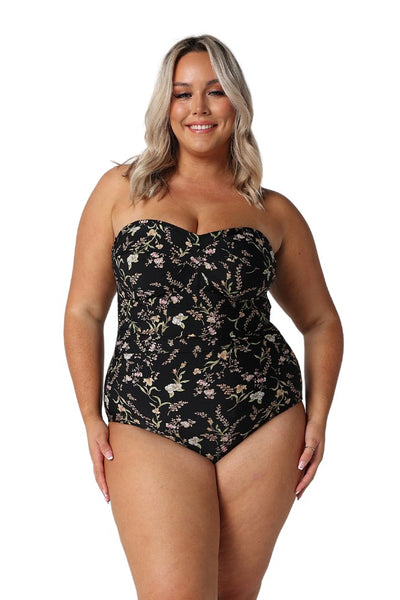 Model wearing black floral strapless one piece