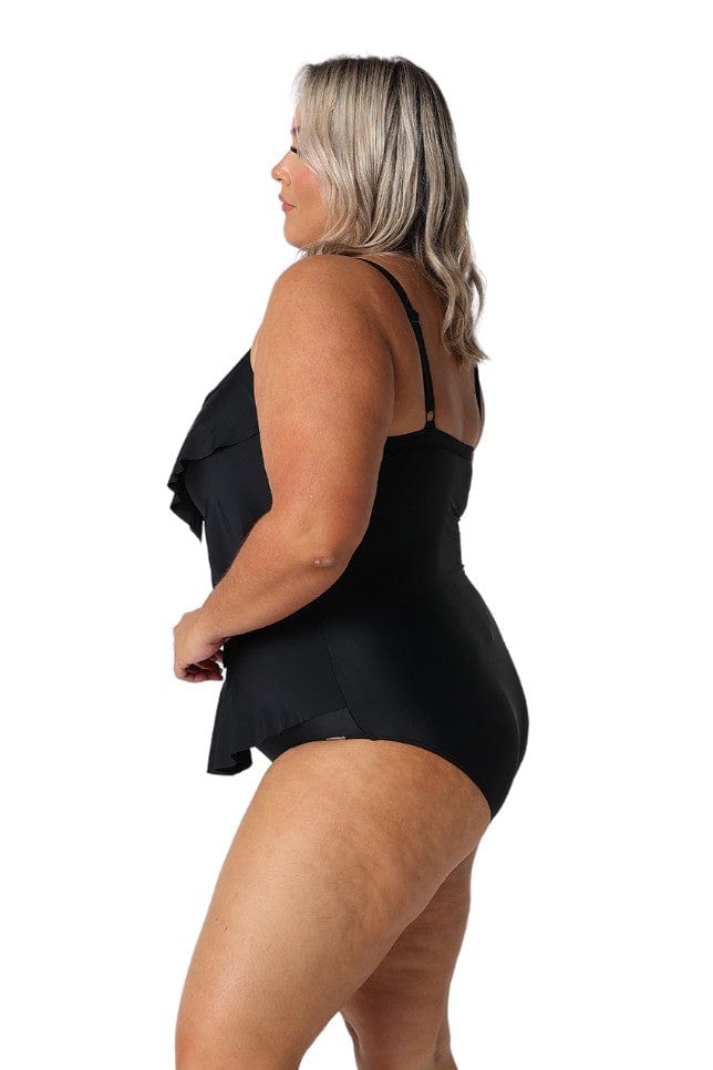 Blonde model showing side of black 3 tier one piece