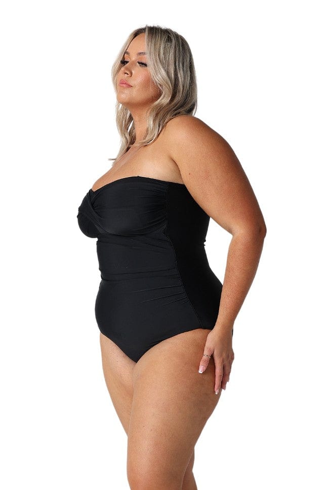 Model showing side of strapless black one piece