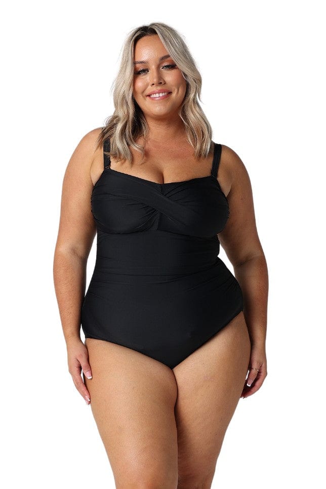 Model wearing black twist front one piece swimsuit