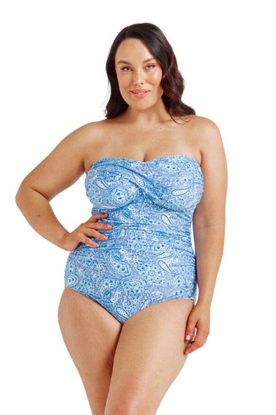 Model wearing blue strapless swimsuit