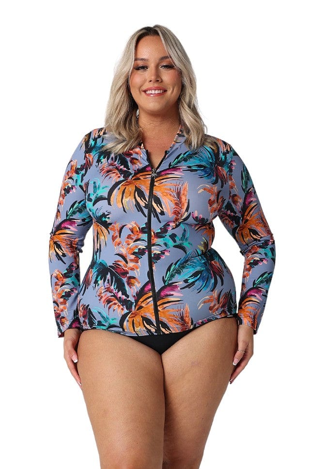 Blonde model in studio wearing floral rash vest with full length sleeves