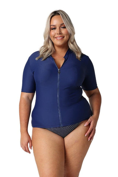 Blonde model wearing navy short sleeve rash vest