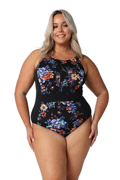 Blonde model in studio wearing chlorine resistant zip front one piece with floral print