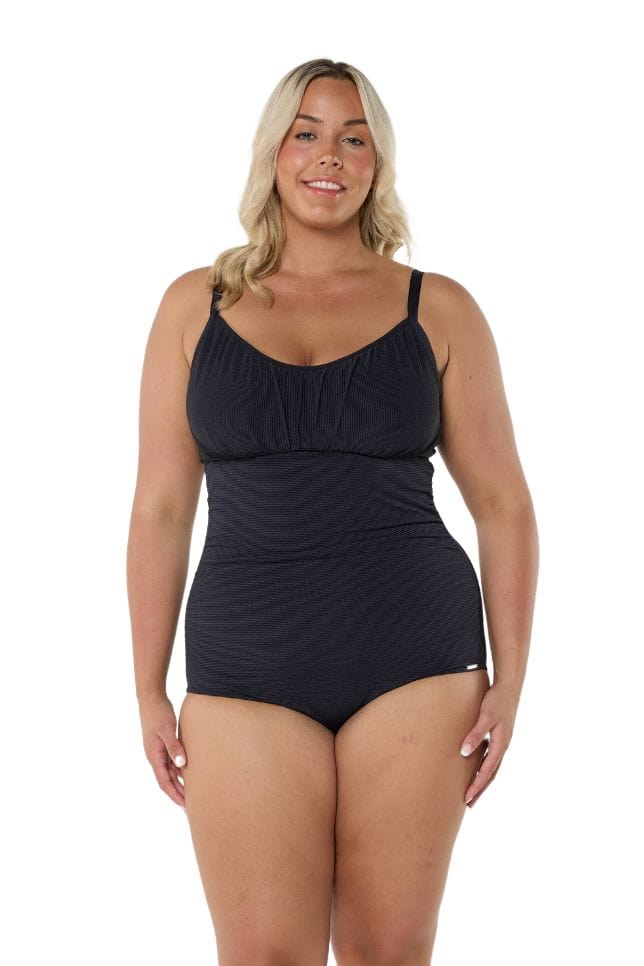 Blonde model wearing black honey comb textured one piece