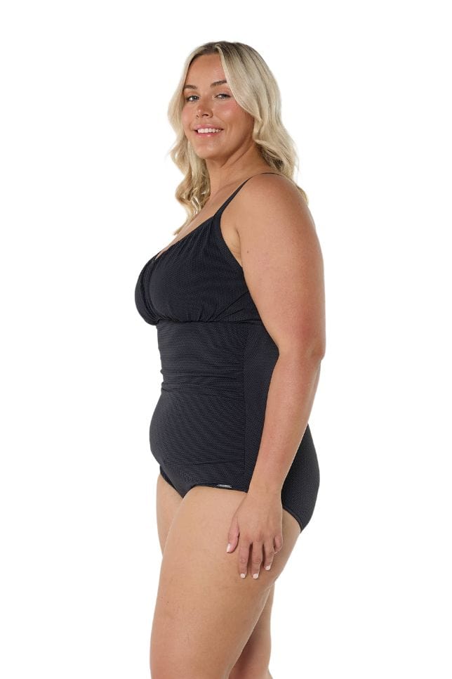 Blonde model wearing black honey comb underwire swimsuit