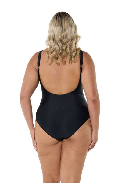 Blonde model wearing black low back swimsuit